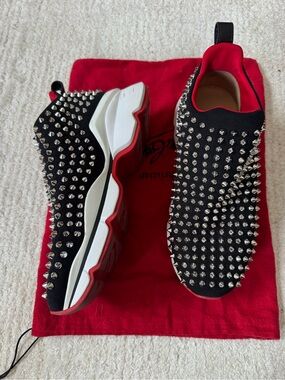 Christian Louboutin Black Suede Slip-Ons with Silver Spikes and Red Trim